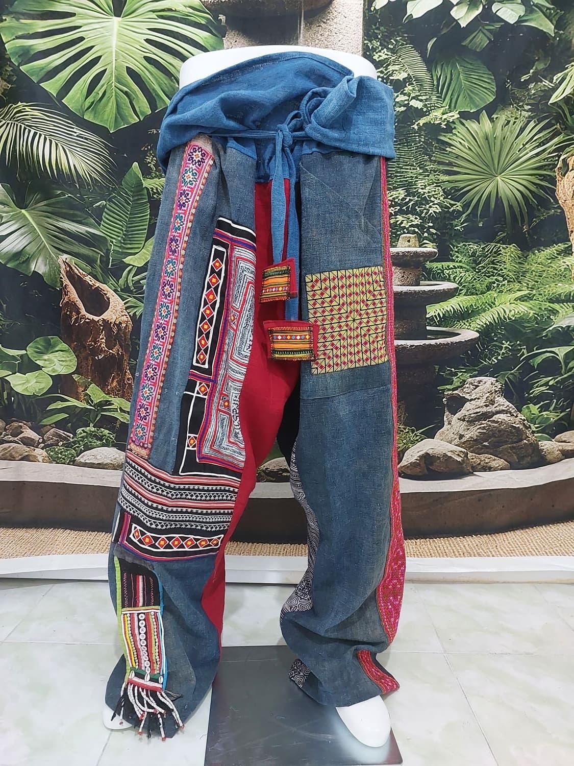 Handwoven tribal shoulder bag with tassel details